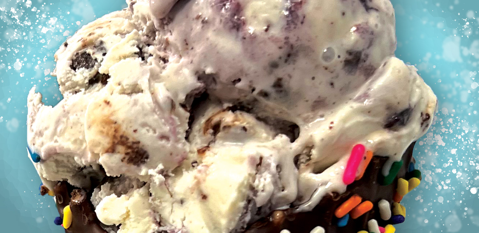 image of alumni swirl ice cream on a chocolate and rainbow sprinkles covered waffle cone for testimonials